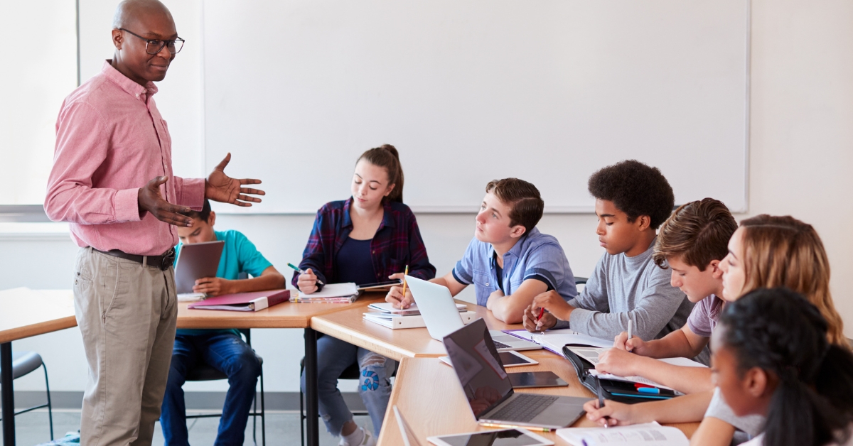 A teacher instructing students in a classroom, representing an OCD and Anxiety Treatment Center.