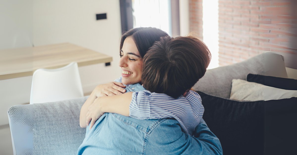 Two people hugging, symbolizing the supportive connection in Acceptance and Commitment Therapy for mental health.