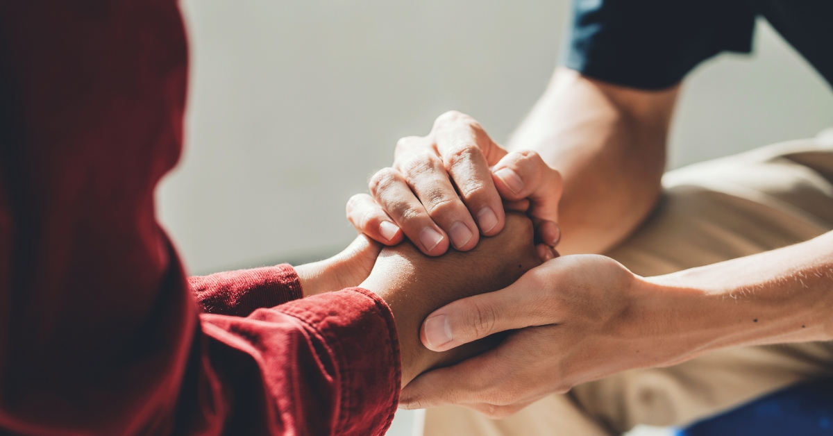 Hands holding in support, representing a complete guide to teen anxiety medication.