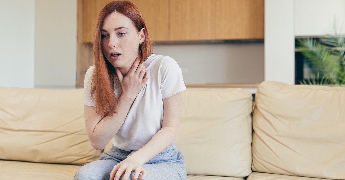 Woman clutching her chest in distress, illustrating Panic Disorder: When Fear Takes Over.