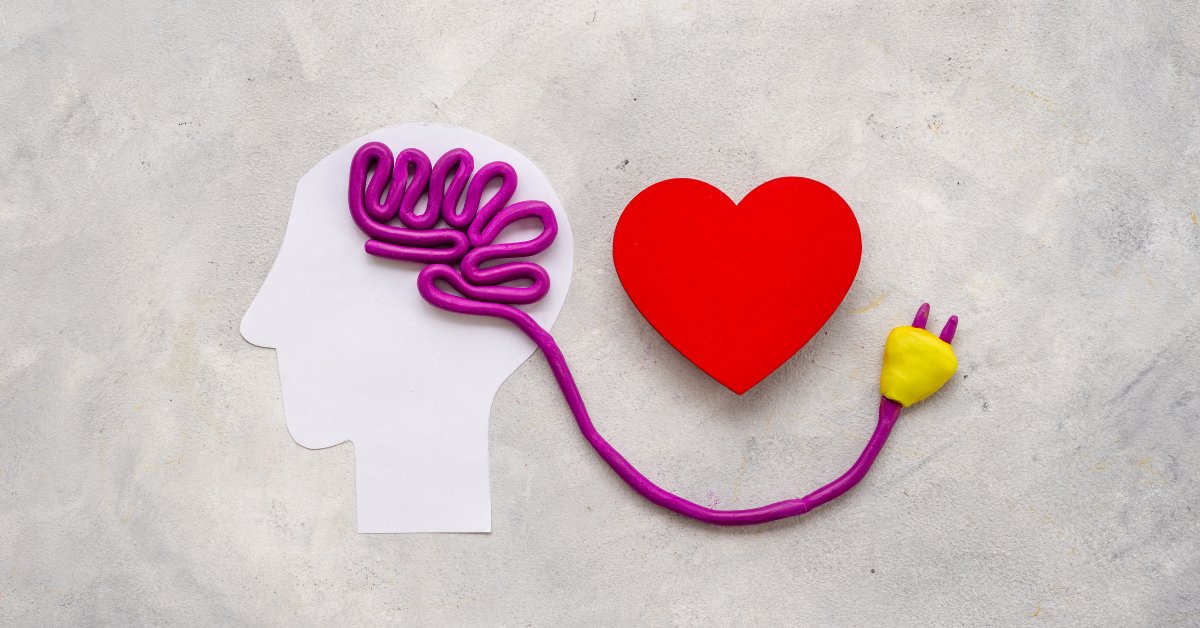 A brain connected to a heart with a cord emphasizes the importance of mental health awareness.