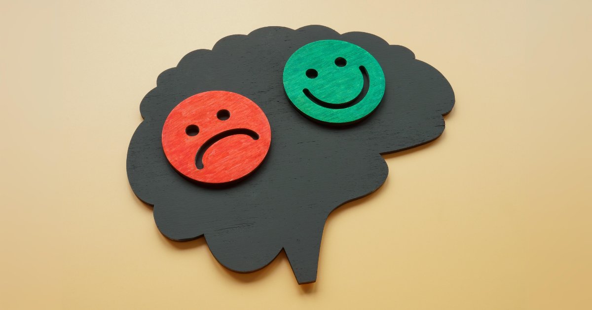 A brain icon with happy and sad faces illustrates the complex relationship between anxiety and bipolar disorder.